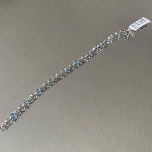 Never worn blue topaz bracelet with bow detail